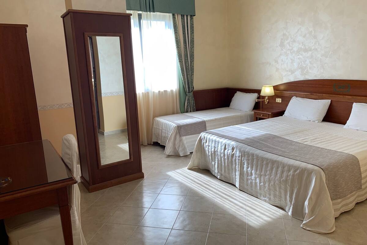 Family Triple Room | Minibar, in-room safe, desk, soundproofing