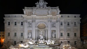 A grand building with classical architecture, featuring a central fountain with statues and inscriptions. - Relais Conte di Cavour de Luxe (Rome)