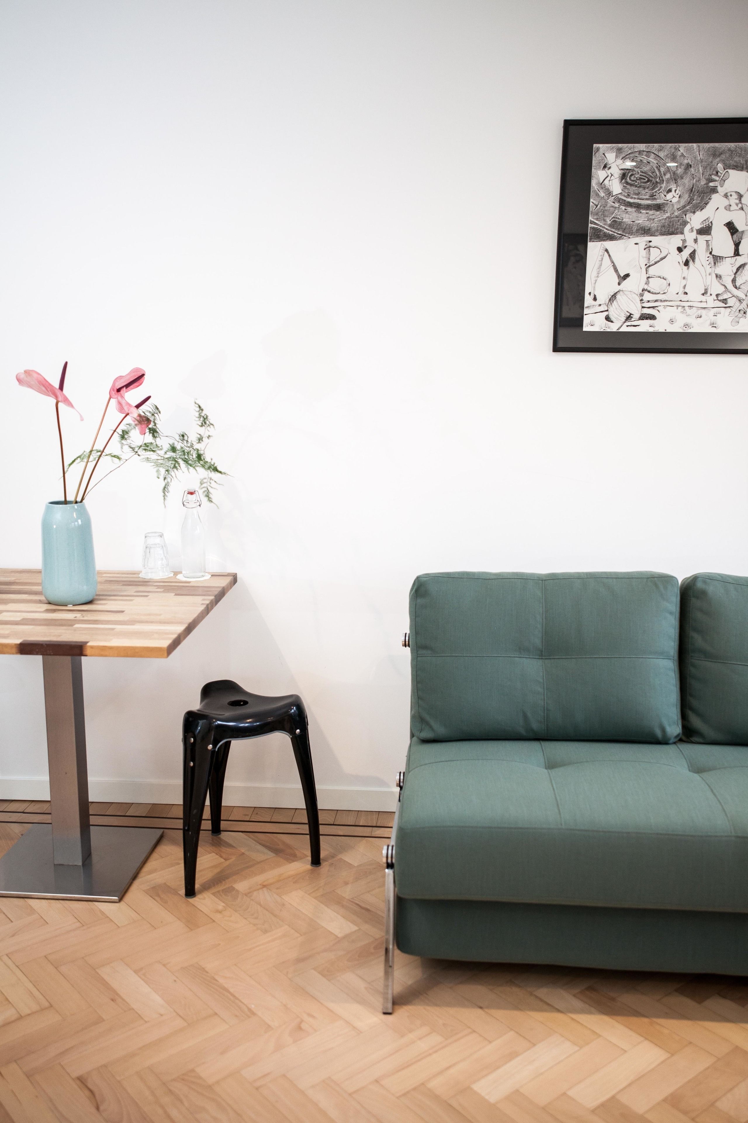 Deluxe Quadruple Room, 1 Queen Bed with Sofa bed, Balcony, City View | Living area