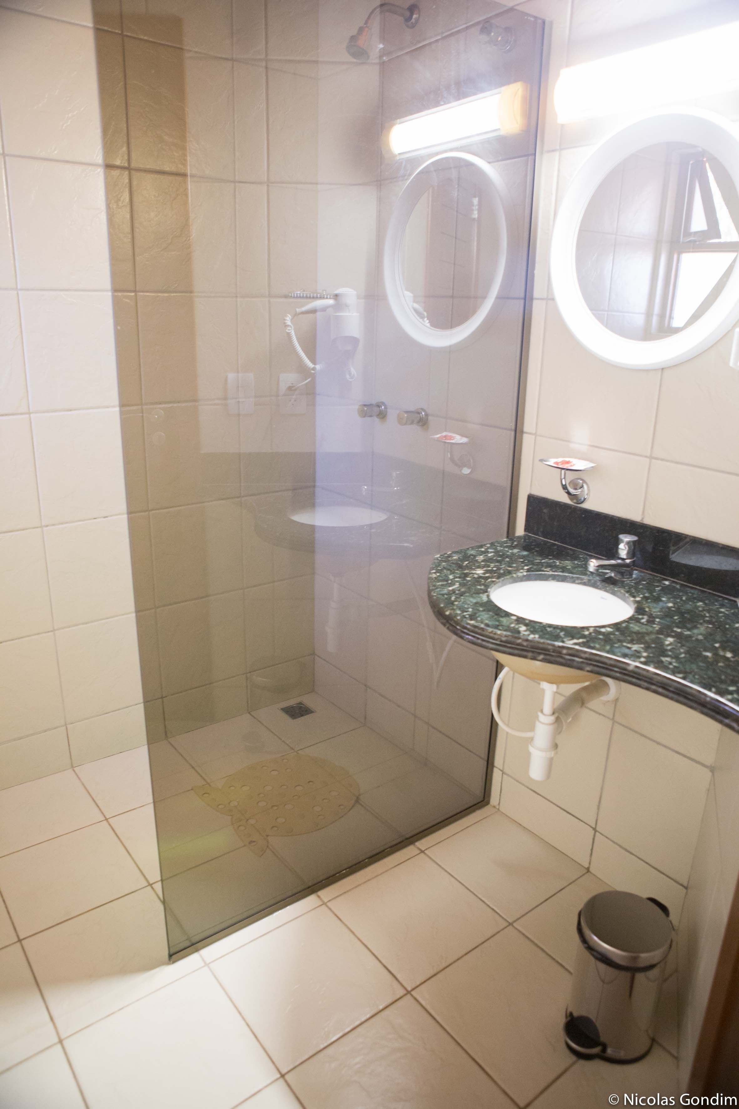 shower, rainfall showerhead, hair dryer, towels