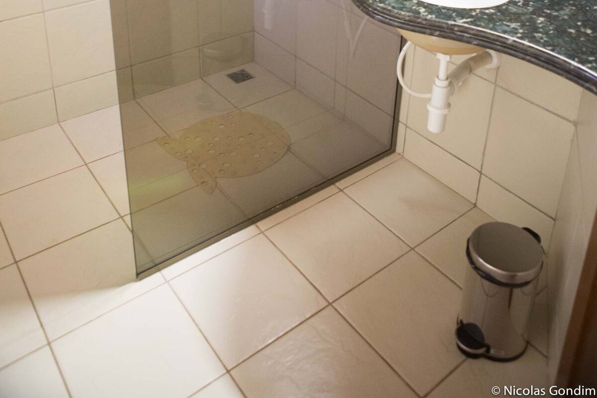 shower, rainfall showerhead, hair dryer, towels