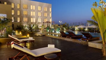 Outdoor pool, open 7:00 AM to 9:00 PM, free cabanas, pool umbrellas