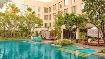 Outdoor pool, open 7:00 AM to 9:00 PM, free cabanas, pool umbrellas