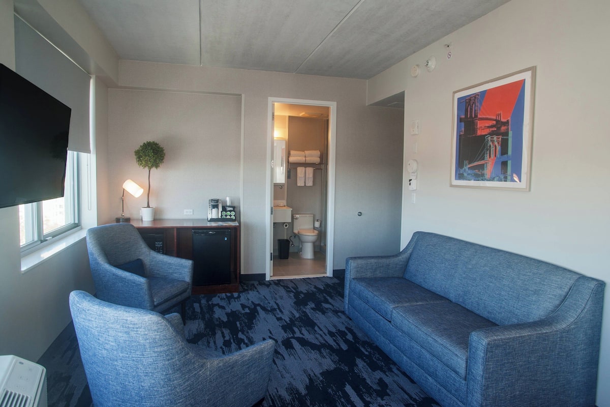 Suite, 1 Bedroom | Living room | 50-inch LED TV with cable channels, TV