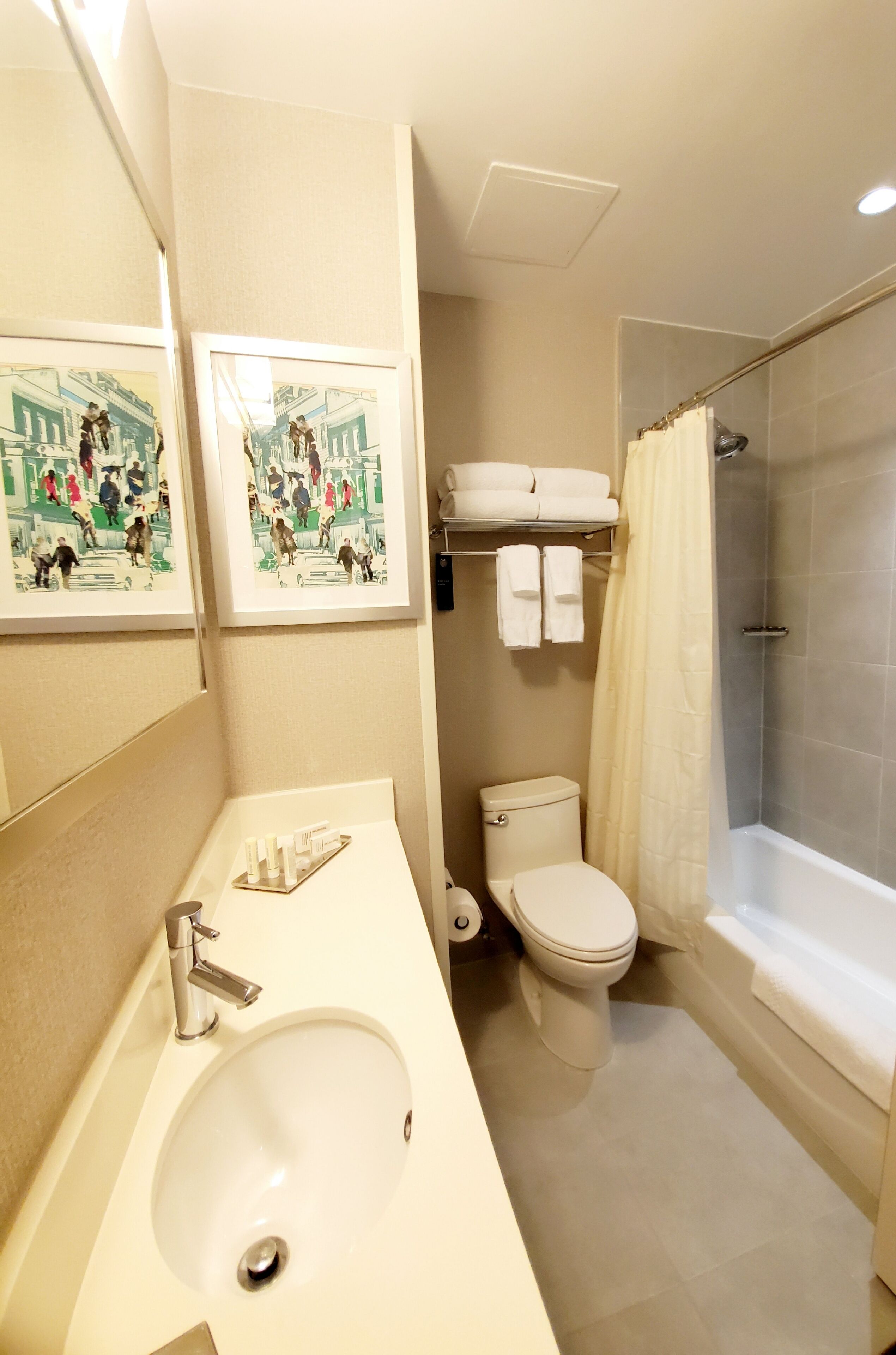 designer toiletries, hair dryer, towels, soap