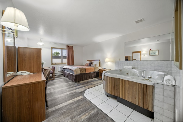 Suite, 1 King Bed | Desk, blackout drapes, iron/ironing board (on request), WiFi (free)