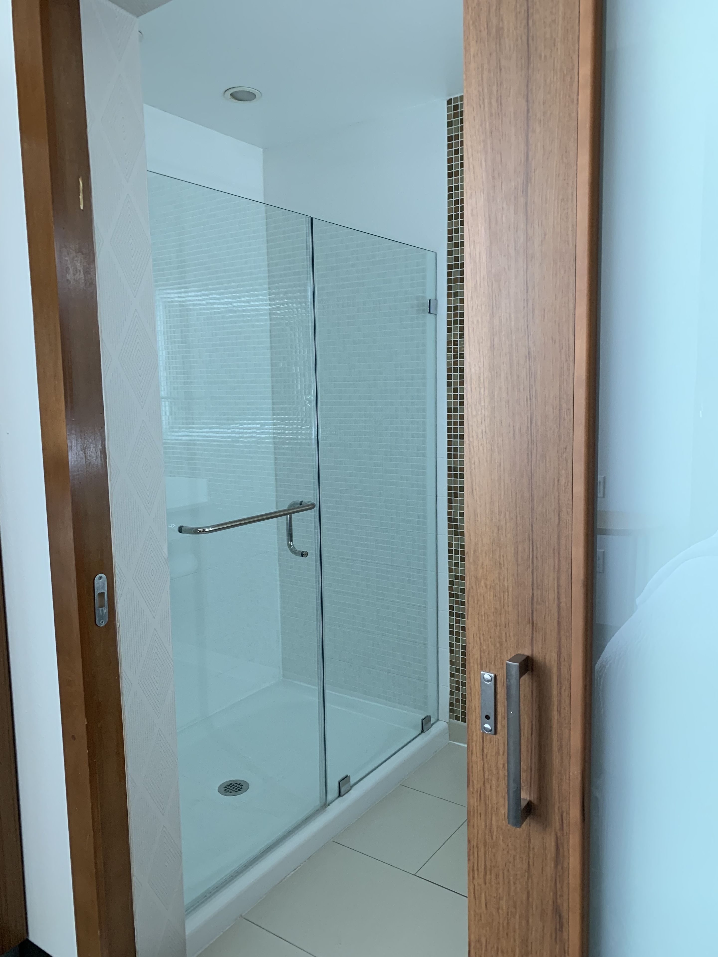 shower, designer toiletries, hair dryer, towels