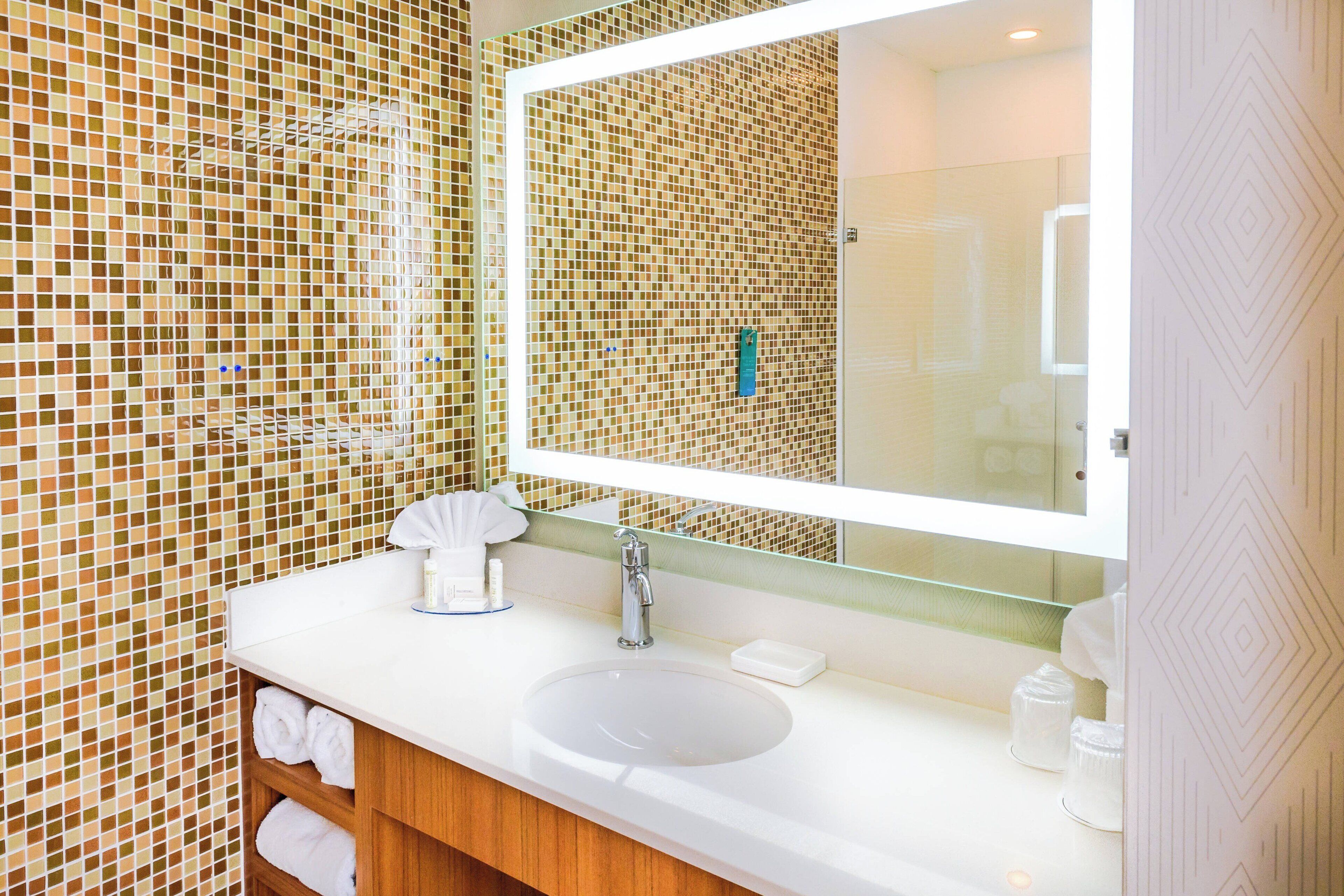 shower, designer toiletries, hair dryer, towels