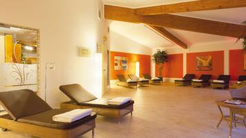 Relax in a spacious area with lounge chairs and artwork adorning the walls.