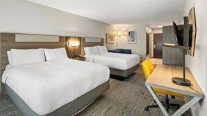 A hotel room with two beds, a desk, and a chair. - Holiday Inn Express and Suites Fairmont by IHG (Fairmont)