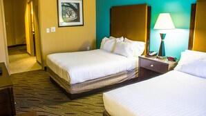 A hotel room with two beds, a nightstand with a lamp, a framed picture on the wall, and a carpeted floor. - Holiday Inn Express Havelock NW- New Bern by IHG (Havelock)