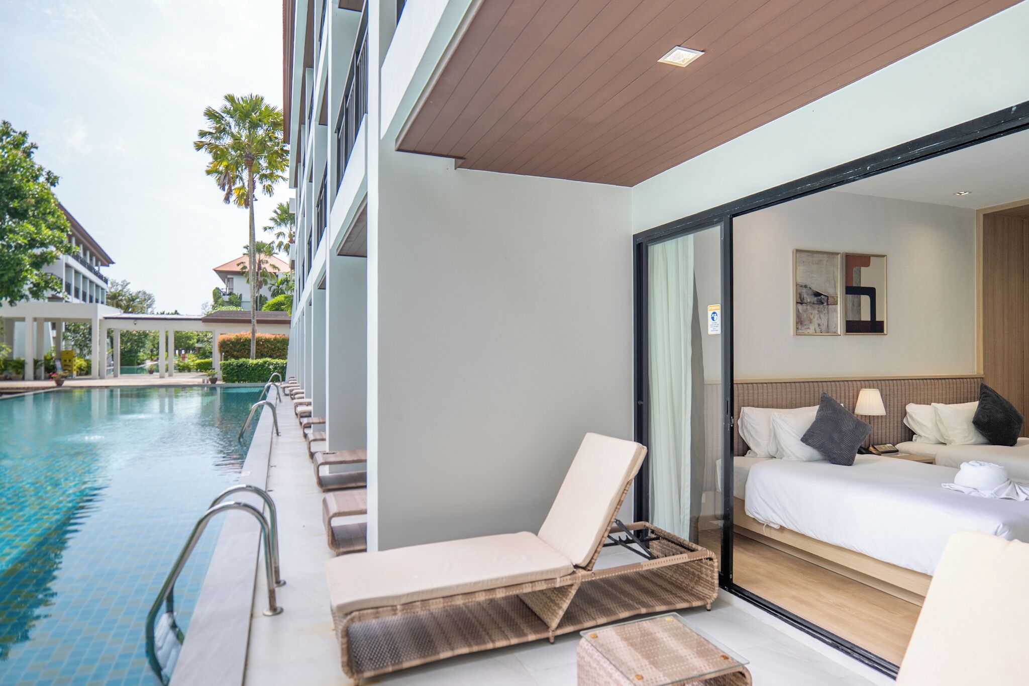 Deluxe Twin Pool Access | Minibar, in-room safe, individually decorated, rollaway beds