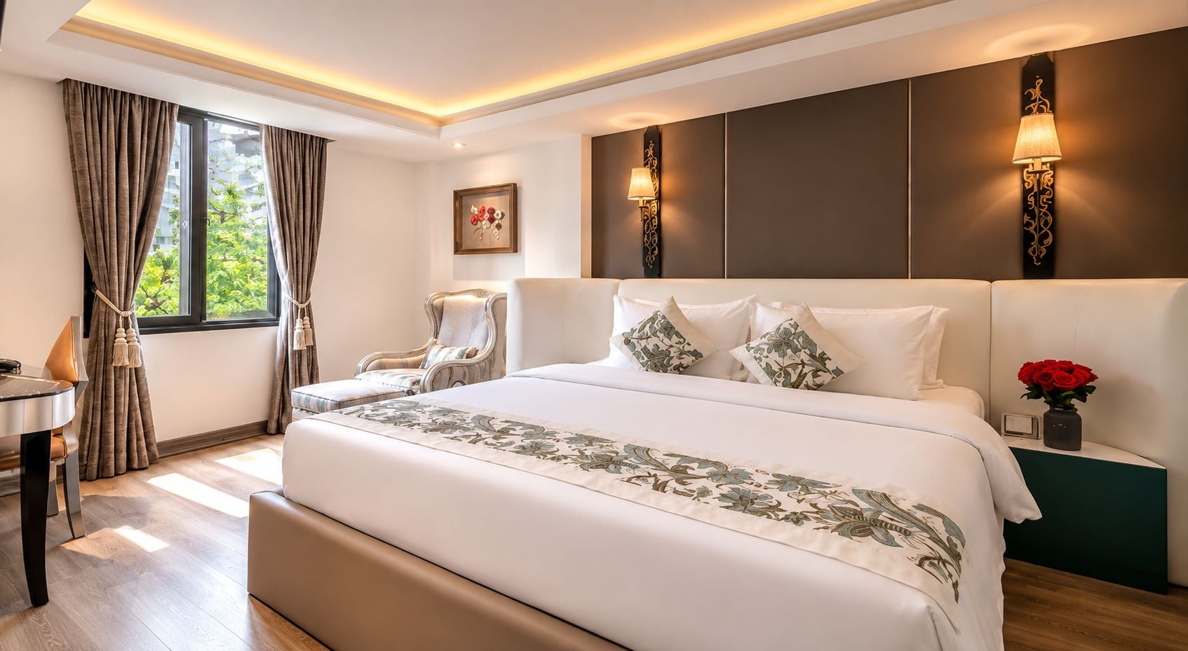 A hotel room with a large bed, a desk, and a chair.