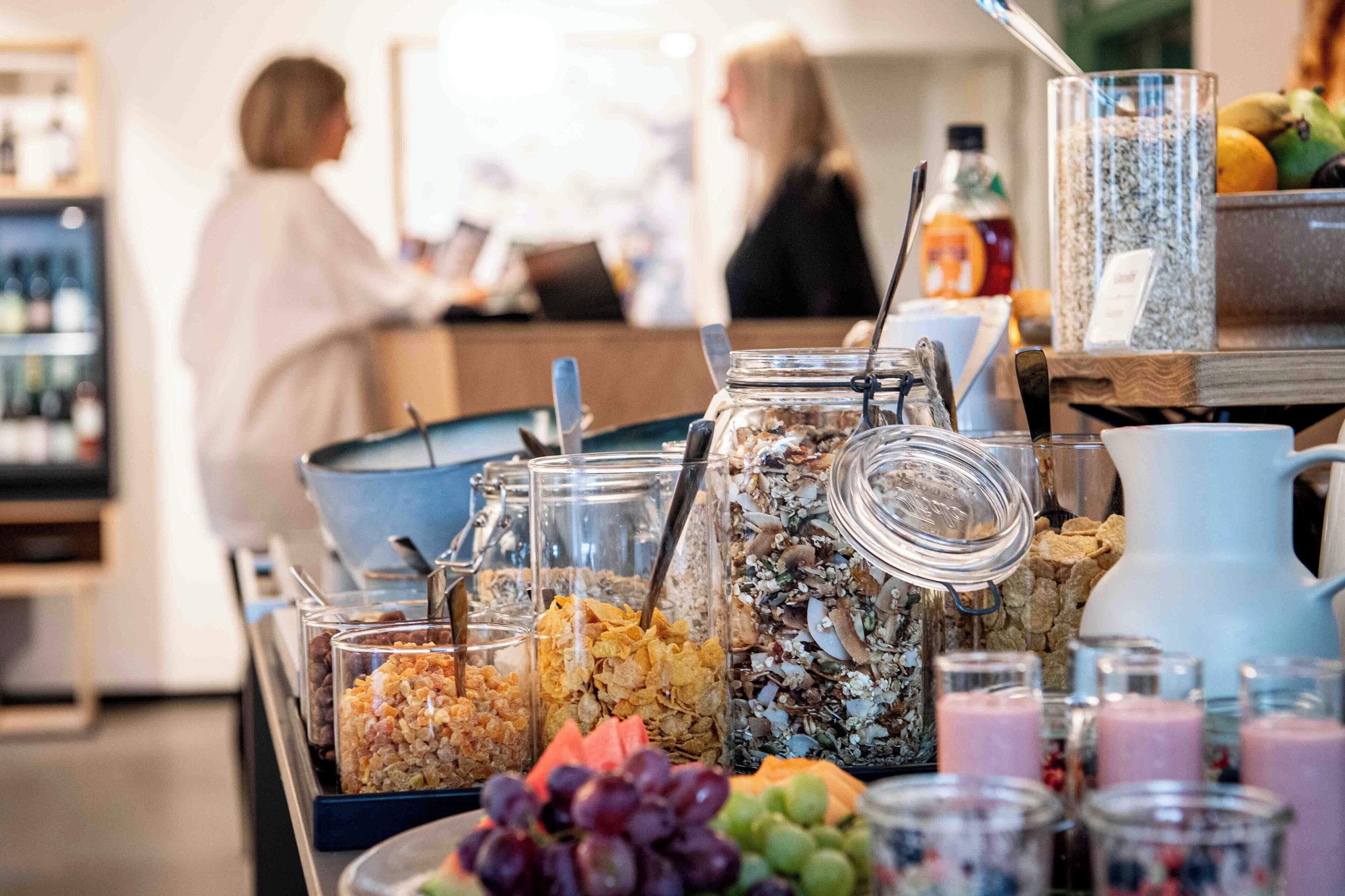 A breakfast buffet with various food items and beverages.
