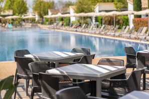 Breakfast, lunch served; international cuisine, al fresco dining 