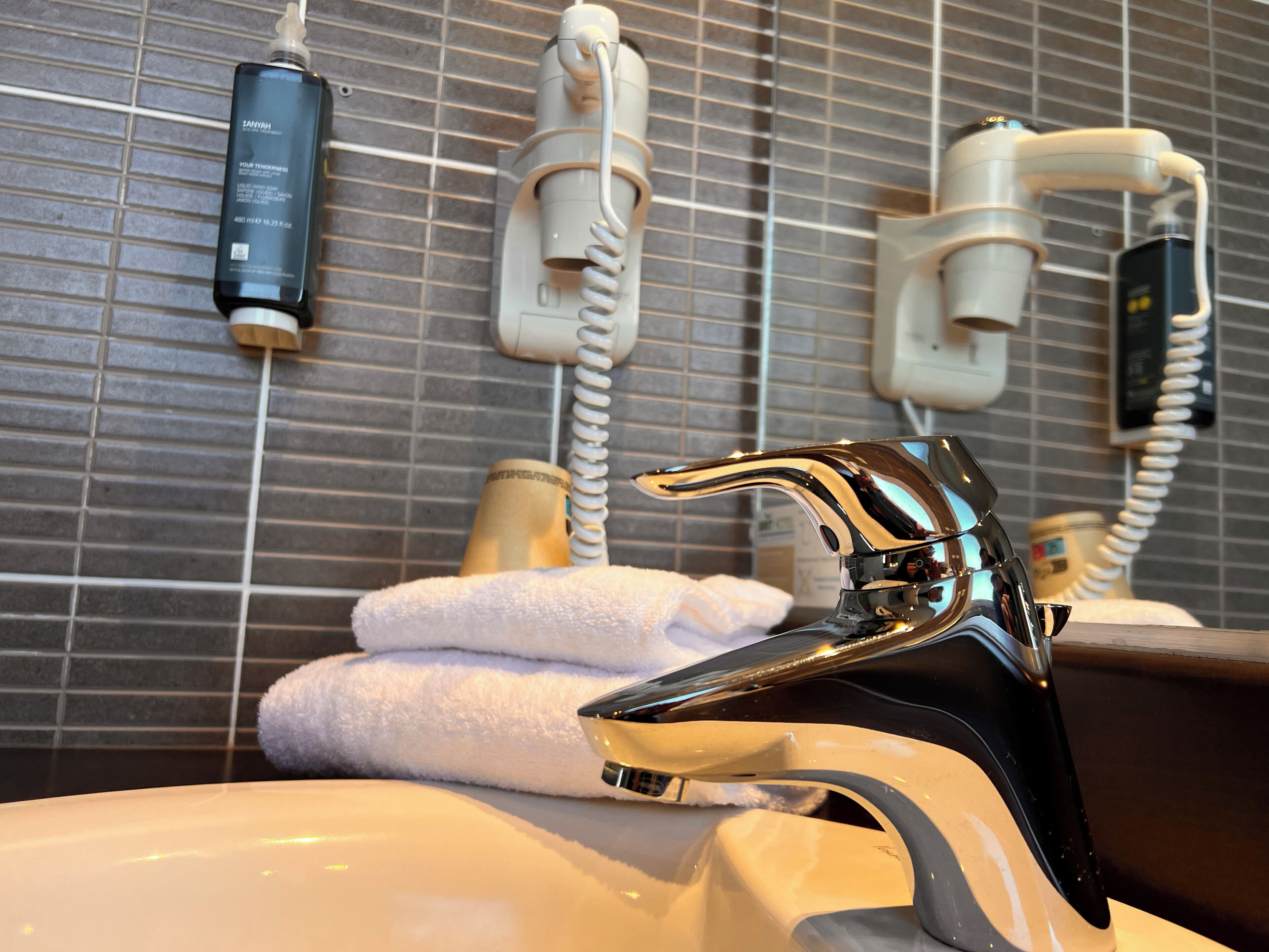 family room | bathroom | hair dryer, towels, soap, shampoo