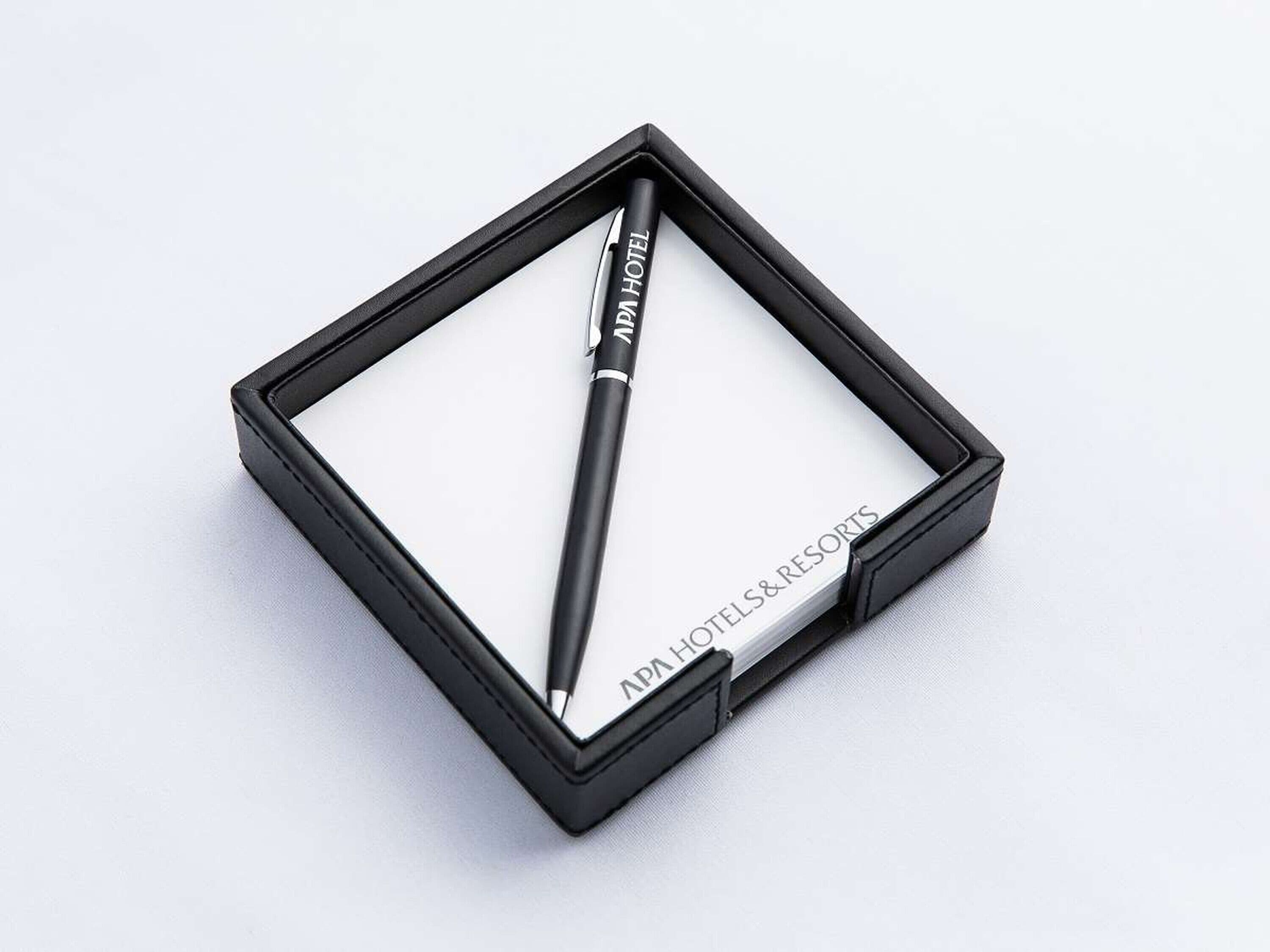 A black pen in a black box with the text "RAPAHOTEL" on it.