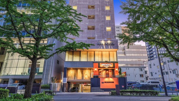 A modern building with a sign for APA HOTEL. - APA Hotel Sendai Kotodai Koen (Sendai)