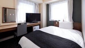 A hotel room with a bed, a desk with a television, a chair, and a window with curtains. - APA Hotel Sendai Kotodai Koen (Sendai)