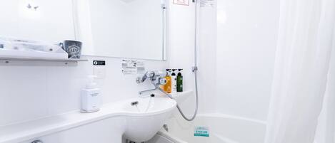 A modern bathroom with a white sink, mirror, and shower. There are toiletries on the counter and a sign indicating water conservation.