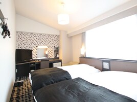 Down comforters, desk, blackout drapes, soundproofing