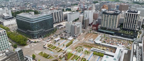 A modern urban area with high-rise buildings, a central roundabout, and a mix of commercial and residential structures.