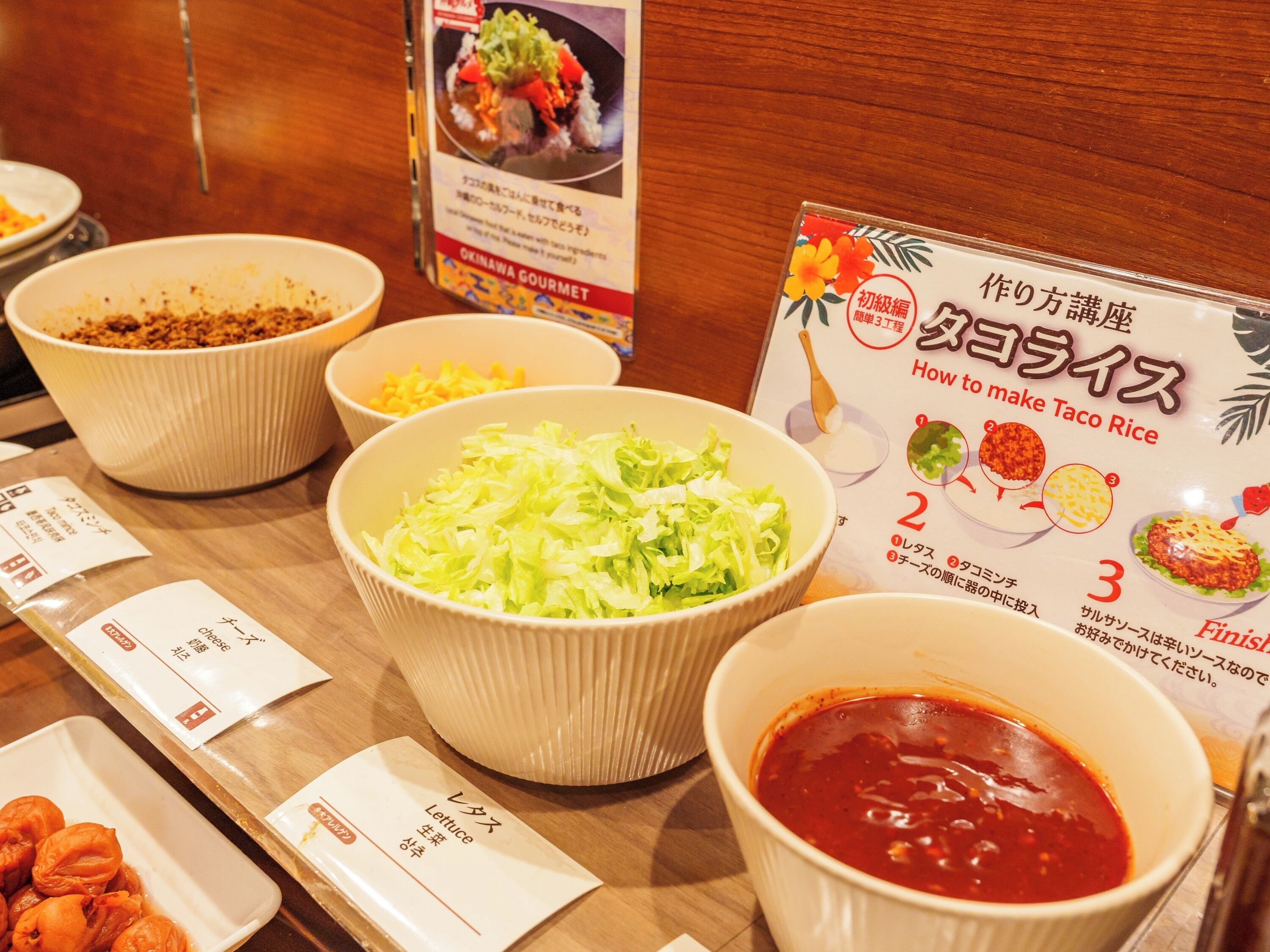 A table with various food items and a recipe card.