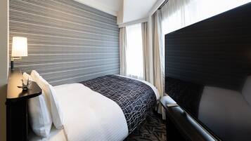 Desk, blackout curtains, free WiFi, bed sheets