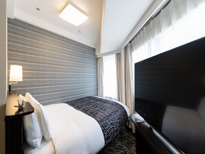 Desk, blackout curtains, free WiFi, bed sheets