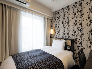 Desk, blackout drapes, free WiFi, bed sheets