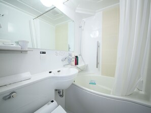 Combined shower/tub, free toiletries, hair dryer, slippers