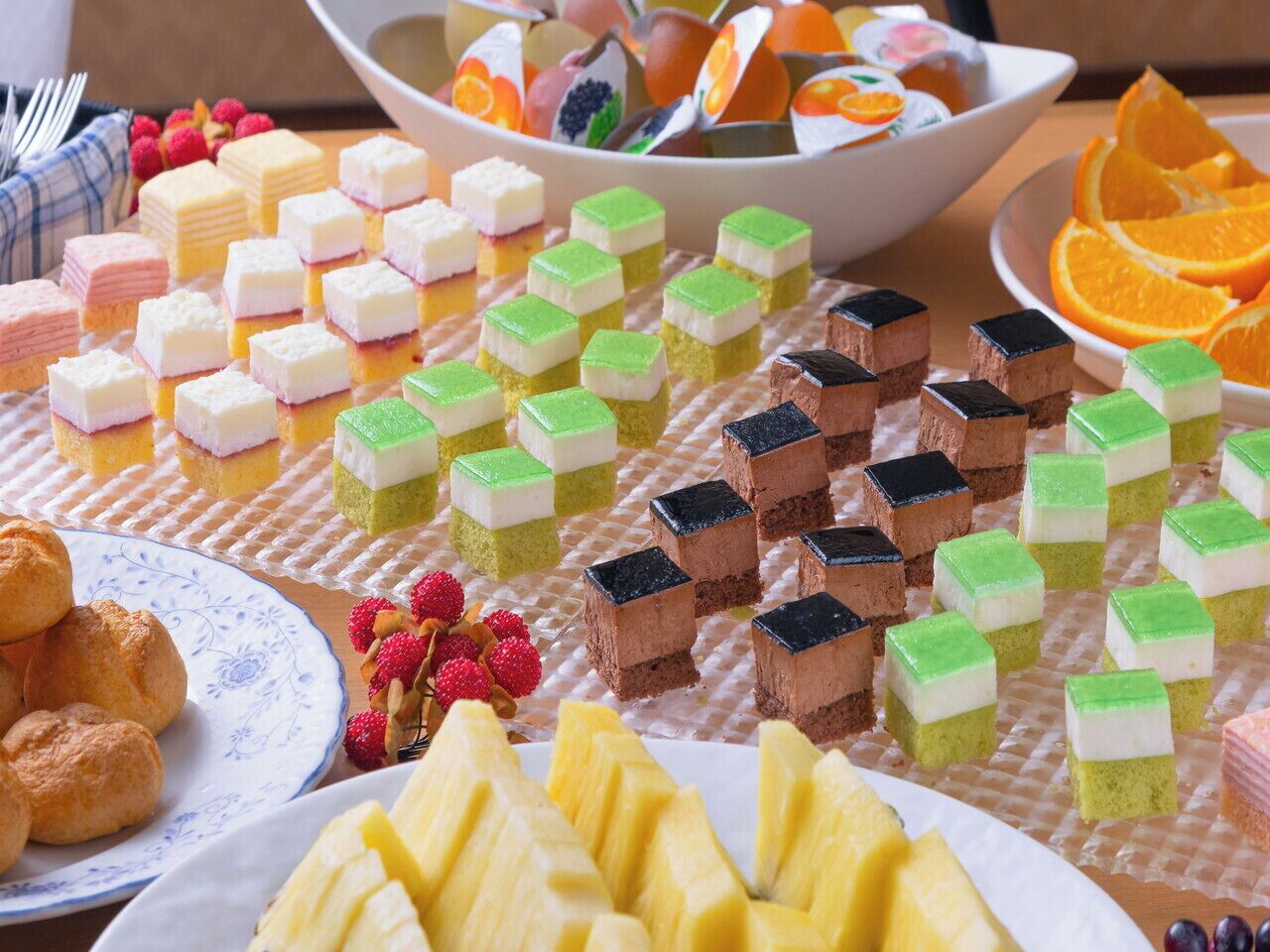 A variety of desserts and fruits on a table.