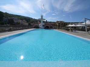 Seasonal outdoor pool, pool loungers, lifeguards on site