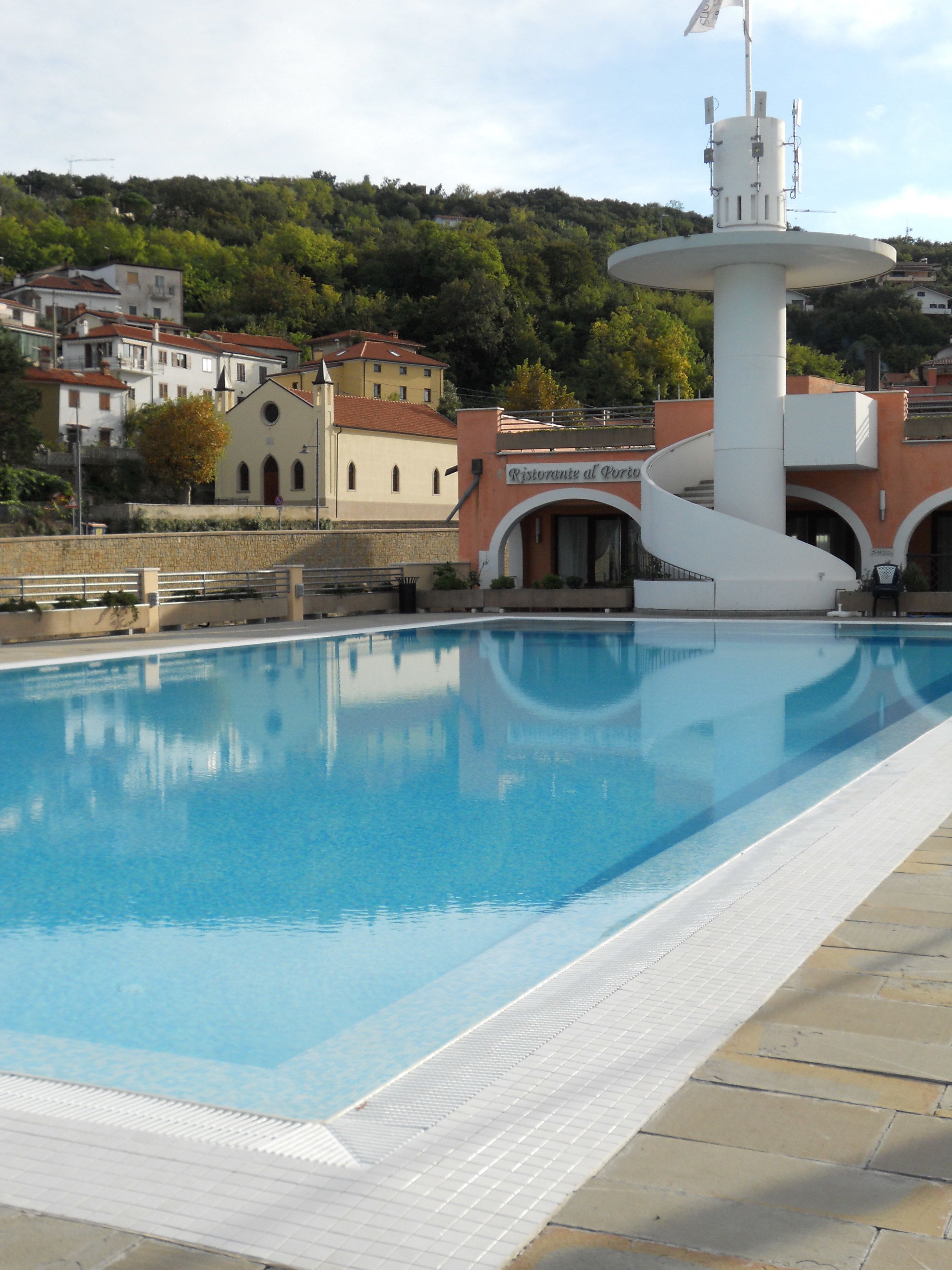 seasonal outdoor pool, pool loungers, lifeguards on site