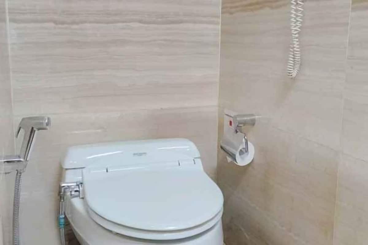 Bathroom | Shower, hair dryer, slippers, towels