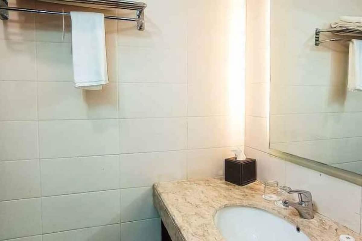 Bathroom | Shower, hair dryer, slippers, towels