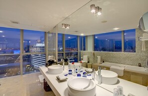 A modern bathroom with two large sinks, a bathtub, and a large window offering a city view. - China National Convention Center (Beijing)