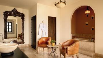 Relax in style with a spacious bathtub and elegant mirror, perfect for unwinding in comfort.