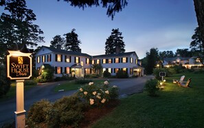 A large, multi-story house with a sign for 'Swift House Inn' indicating it is a lodging establishment. - Swift House Inn (Middlebury)
