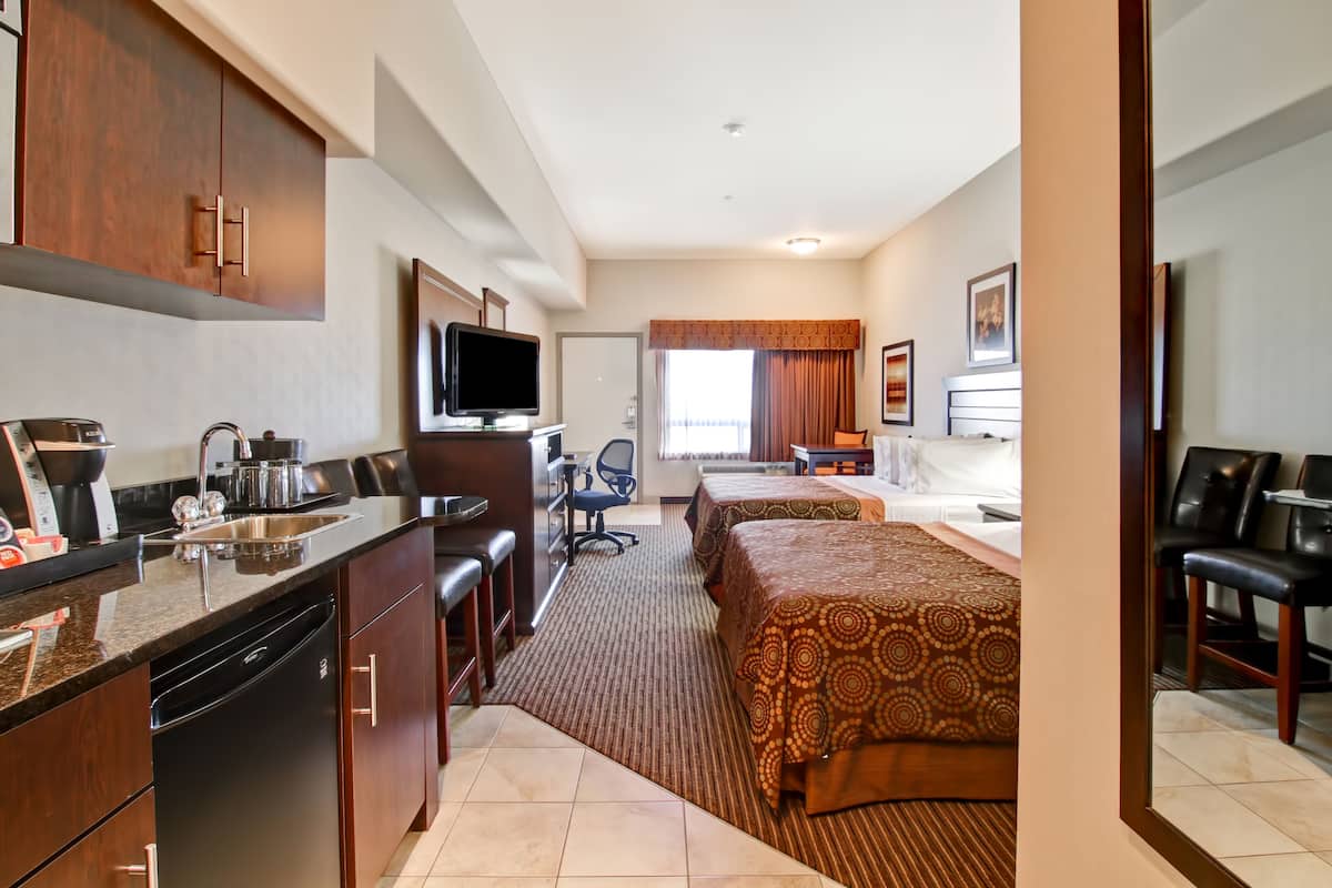 pillow-top beds, desk, laptop workspace, blackout curtains