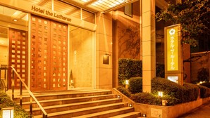 A hotel entrance with a sign reading "Hotel the Lutheran." - Hotel the Lutheran (Osaka)