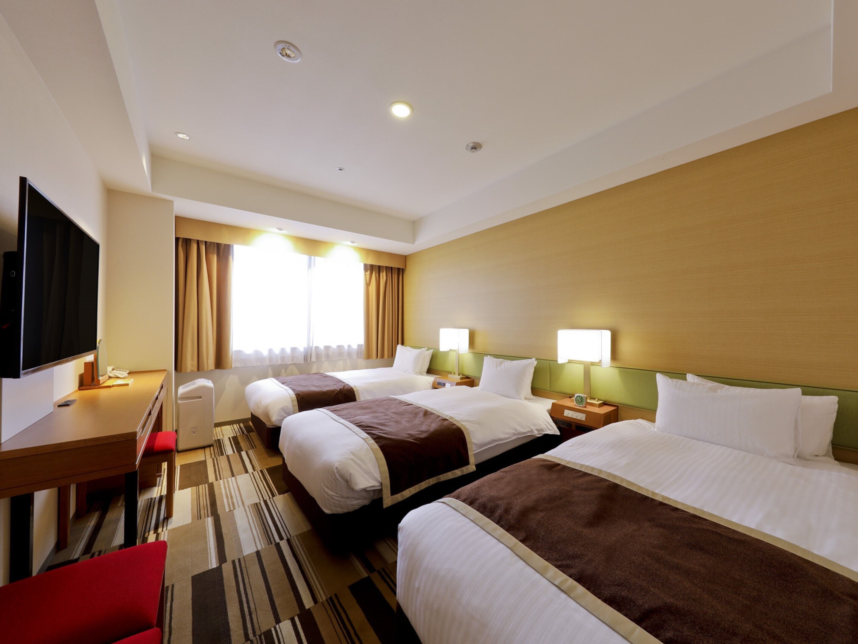 economy triple room, non smoking | 1 bedroom, in-room safe, desk, blackout curtains