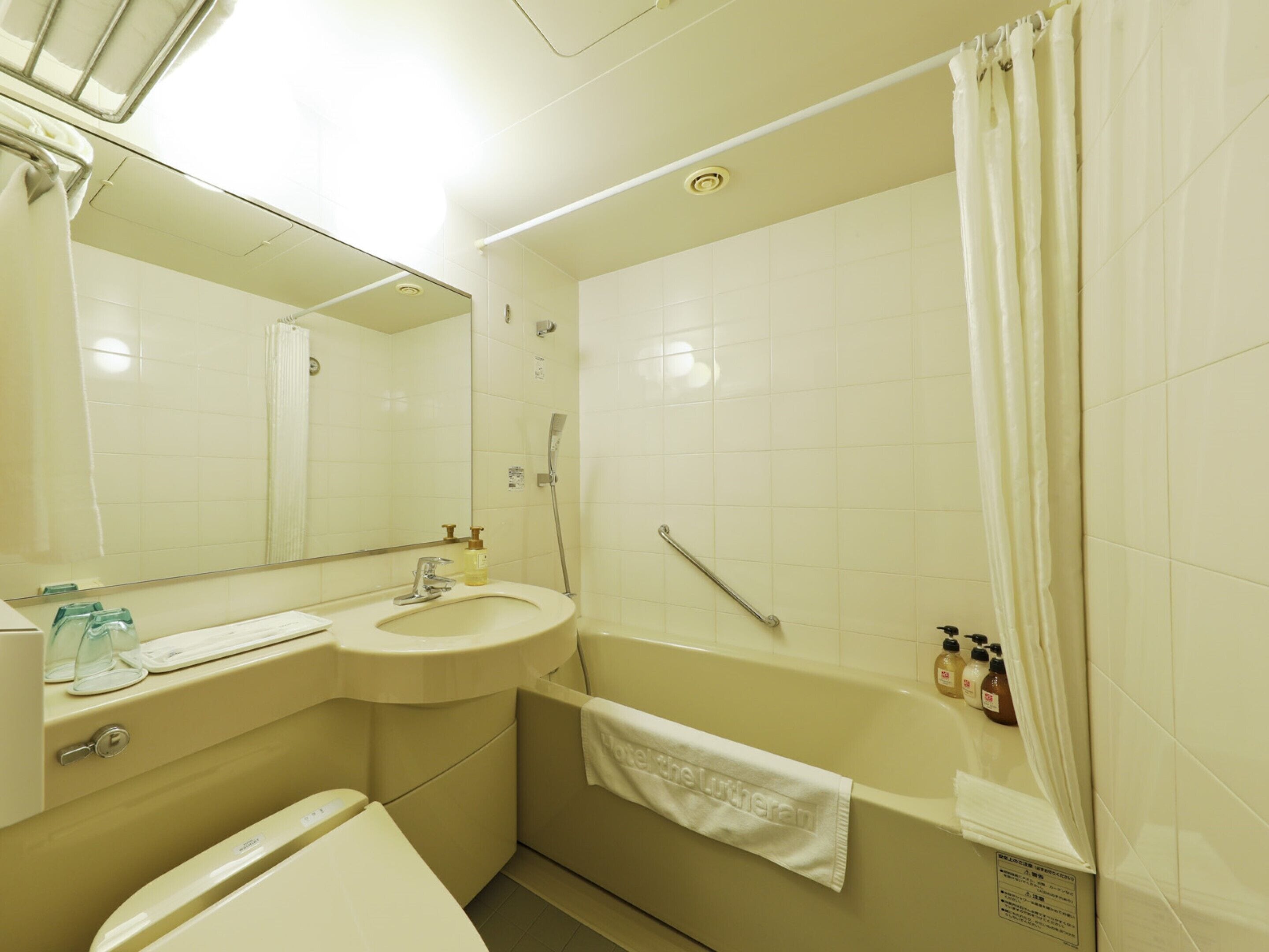 combined shower/bathtub, hair dryer, slippers, electronic bidet