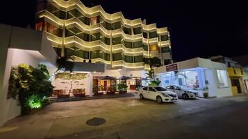 Experience the unique zigzag design of this hotel, featuring multiple balconies and a convenient ground-level entrance with a restaurant.