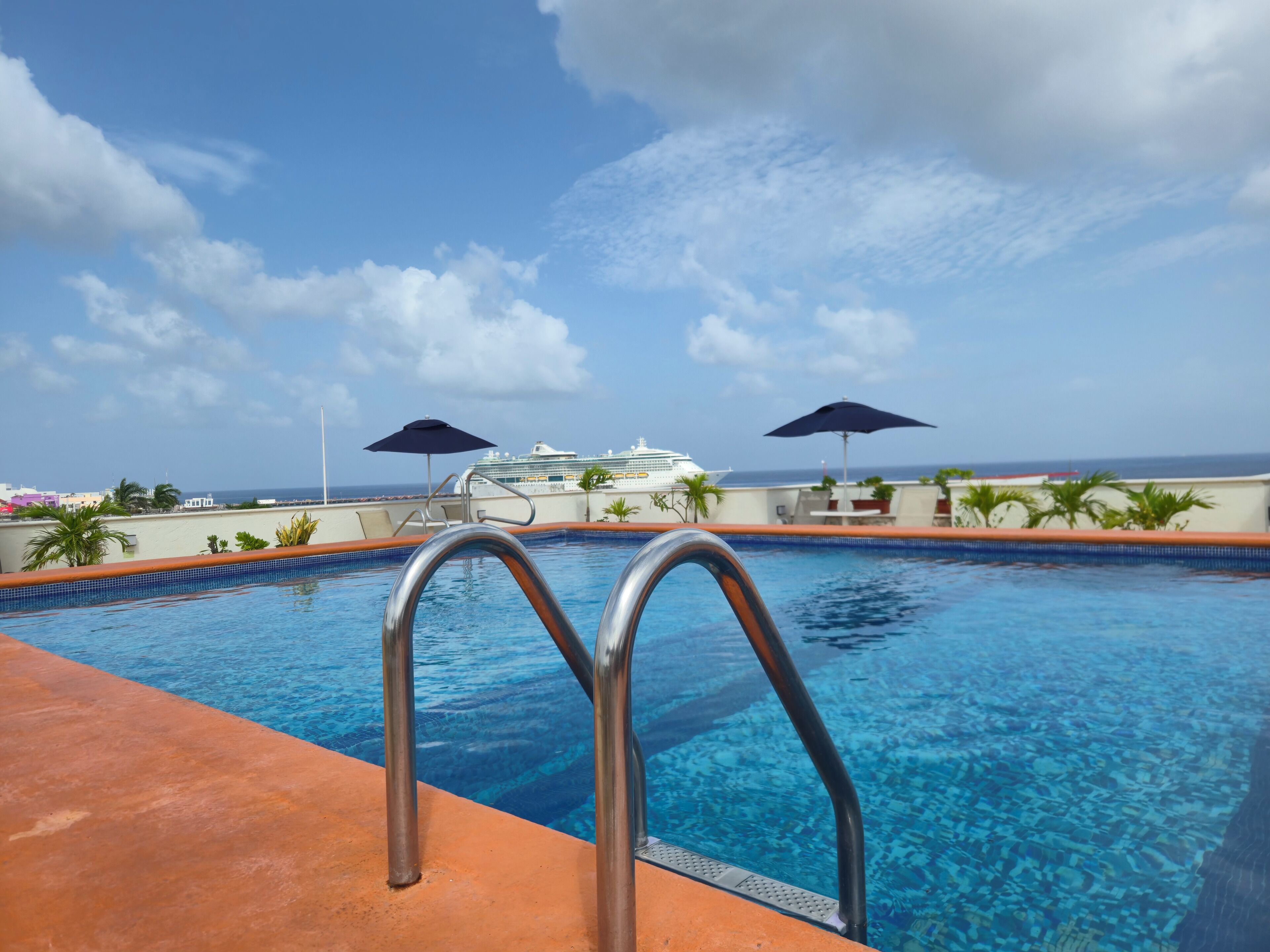 Outdoor pool, open 9:00 AM to 11:00 PM, pool umbrellas, sun loungers