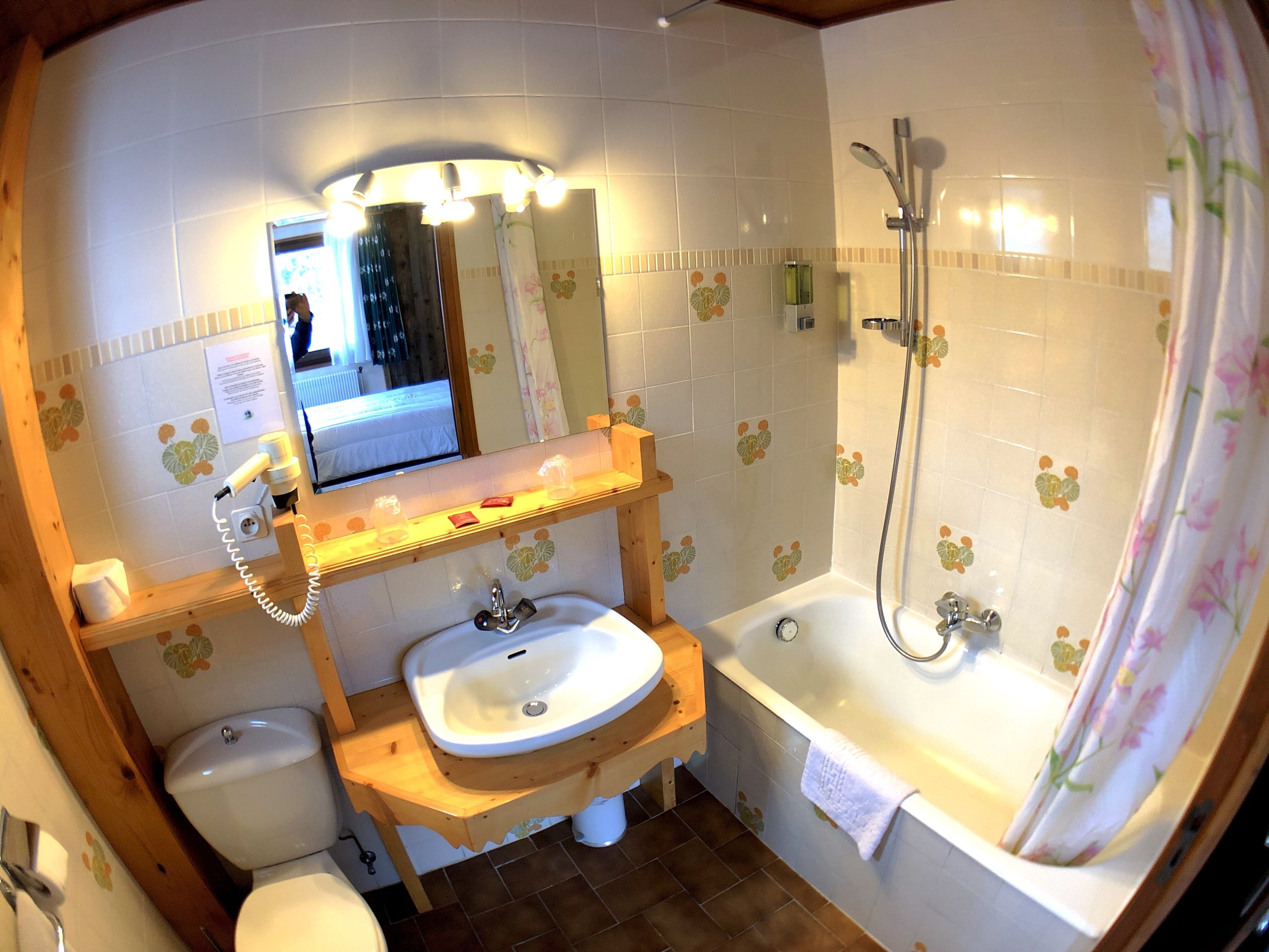 bathtub, free toiletries, hair dryer, towels