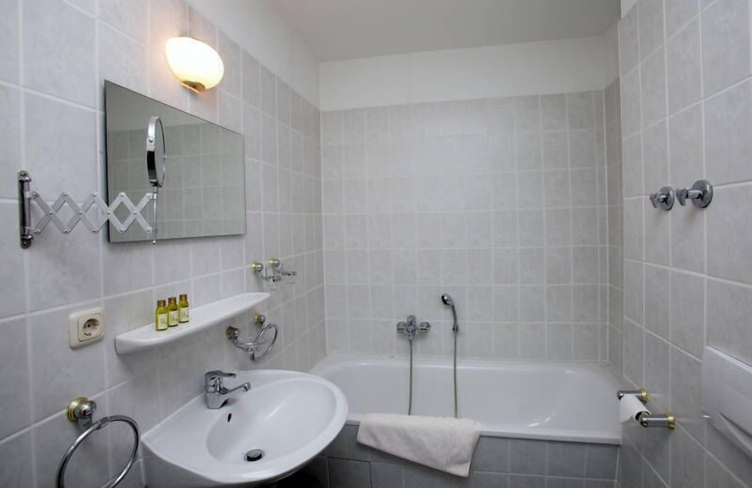 family room | bathroom | combined shower/bathtub, hair dryer, towels