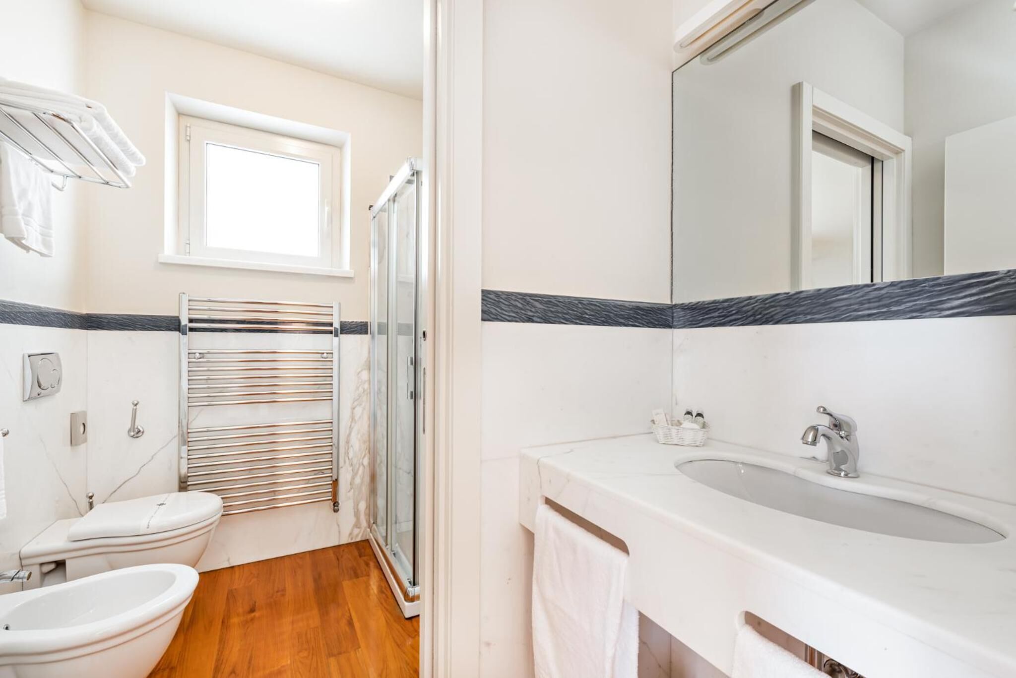 shower, hair dryer, bidet, towels