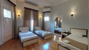 Classic Quadruple Room | In-room safe, individually decorated, desk, laptop workspace