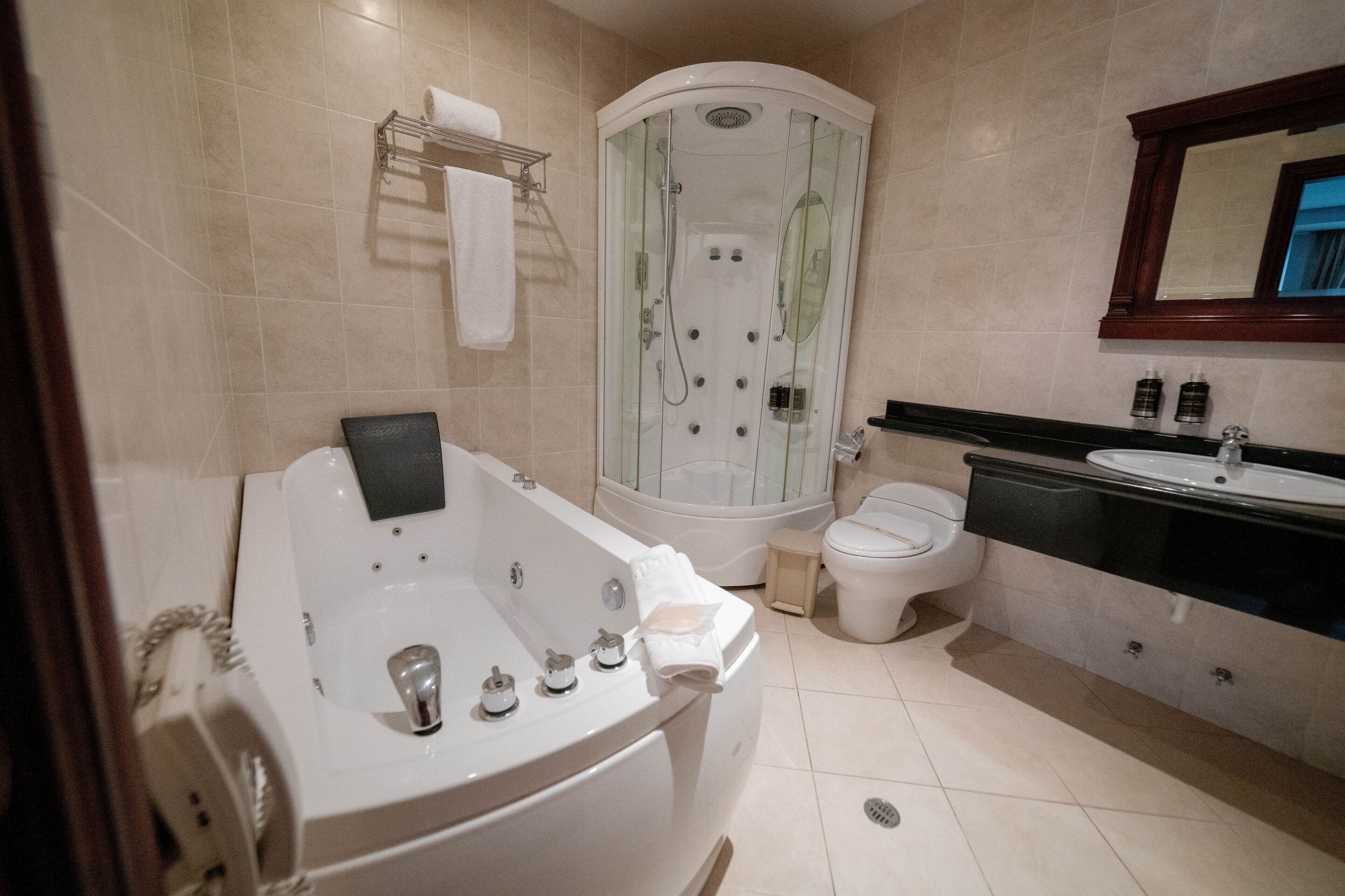 junior suite | bathroom | separate bathtub and shower, deep-soaking bathtub, free toiletries